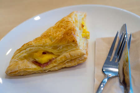 Fresh baked ham cheese pies in a plate.