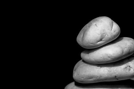 Stack of zen stones on wooden background ( black&white )の写真素材