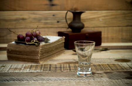 Empty Cocktail Glass  - Small Shot. on wooden backgroundの写真素材