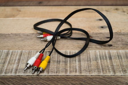 Old RC cable on wooden background