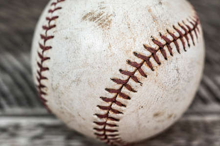 Old base ball on wooden tableの写真素材