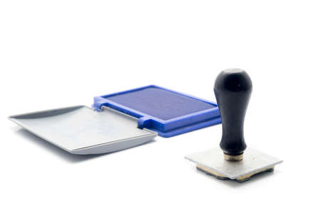 Rubber Stamp with the blue ink place on the white background.の写真素材