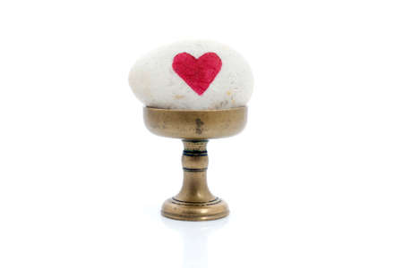 stone painting heart on white 