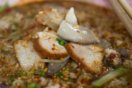 Yellow noodles with Tom Yum soupの写真素材