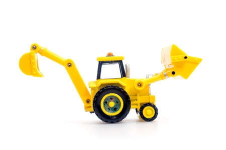 Tractor with backhoe and loader toy isolated on white bacground . Children's Developmental, creative thinking toy car.の写真素材