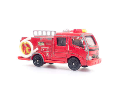 Old red fire truck on a white background. の写真素材