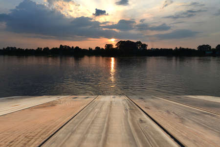 Wooden Balcony with sunset on the riverの写真素材