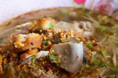 Yellow noodles with Tom Yum soup