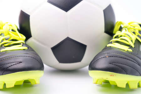 Football and a football shoes  isolated on white background.の写真素材