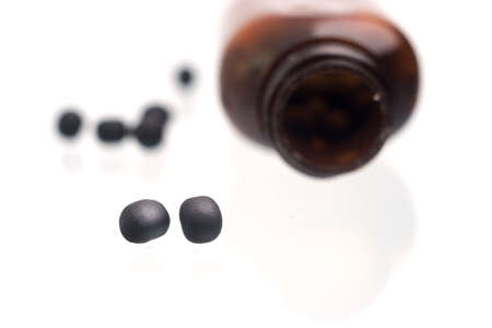 Bottle and bolus on a white background.