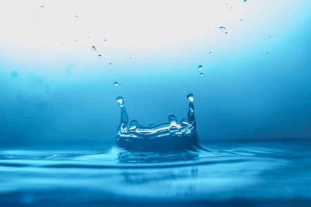 Drop of water. Blue water drop. Water splash close-up.の写真素材