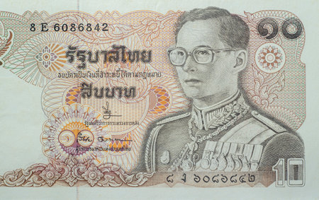 Chainat Province, Thailand, 3 July 2019. illustrative editorial,Ten baht banknotes of Thailand. The portrait of King Rama IX in the uniform of the Supreme Commander. Issue Date September 20, 1980のeditorial素材