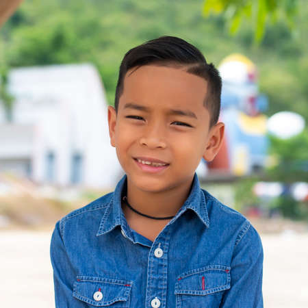 Asian boy smiling happy looking at the cameraの写真素材