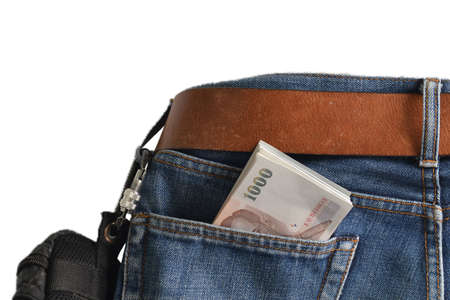 Banknote thai baht bill in jean pocket,Thailand money 1000 bahtの写真素材