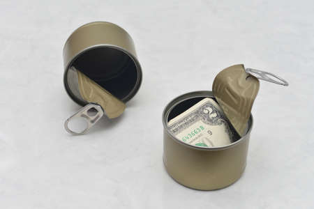 USD in open cans. Money to spend on food