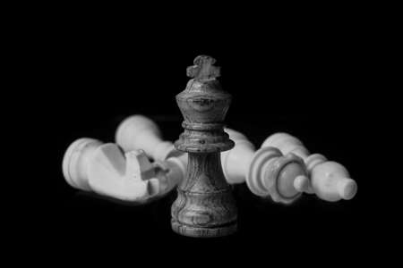wood chess king pieces isolated on a black background.concept of business ideas and competition and...
