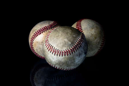 Baseball ball on black background. American traditional sports game.の写真素材