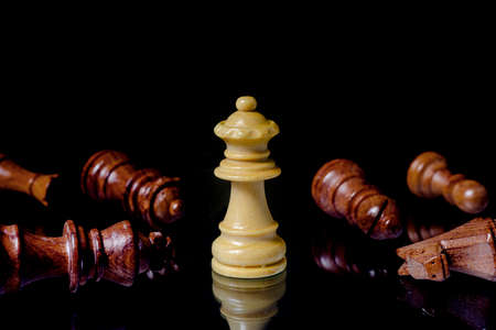 wood chess queen pieces on black background. concept of business ideas and competition and stratagy plan success meaning.の写真素材