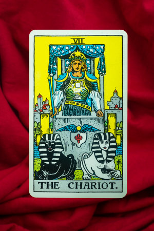 Yala Province, Thailand, June 1, 2022- The Chariot Tarot Card of Rider Waite deck on red fabric...