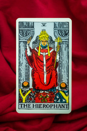 Yala Province, Thailand, June 1, 2022- The Hierophant Tarot Card of Rider Waite deck on red fabric...