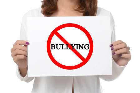 woman showing and holding billboard say no bully  isolated on white backgroundの写真素材