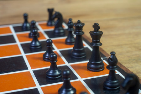 Chess set on the chess board. Close up Black chess game pieces, figures on chess board.