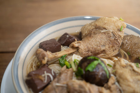 Duck noodles in bowl on wooden table  Thai food.の写真素材