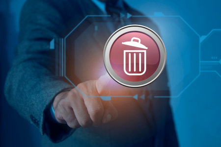 Businessman finger pushing red delete button on virtual touchscreen interface, Deleting business data concept.の写真素材