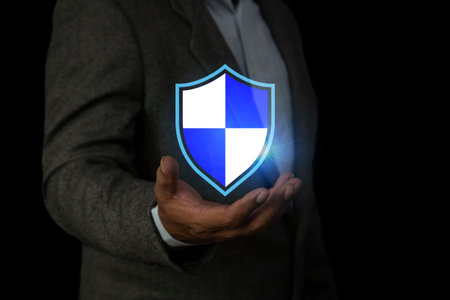 Businessman is holding a cybersecurity icon. Cyber security  internet security or information protection service concept.の写真素材