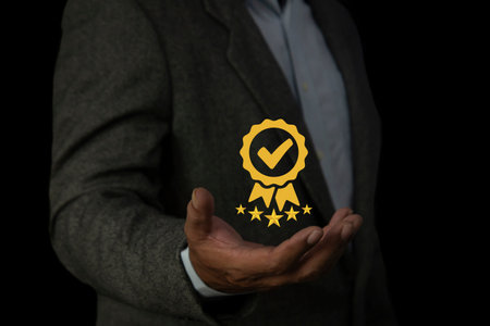 Businessman hand shows the sign of the top service quality. assurance, Guarantee, Standards, ISO...