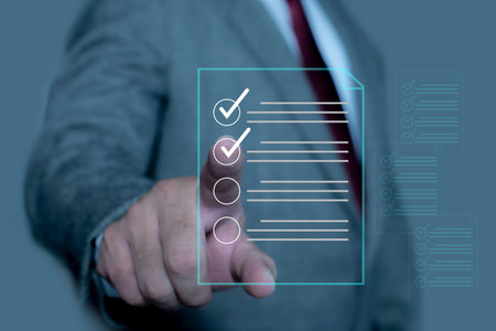 Businessman check and check mark on document online. Businessman tick off questionnaire, Business Agreements and Approvals, Digital checklist option. Check list concept.の写真素材