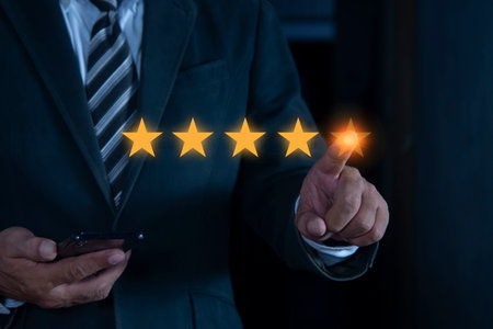 Businessman hand of client giving a five star rating. Customer service experience and business....