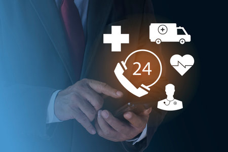 Human hand touching Emergency app from smartphone for elderly, 24 hour support line.
