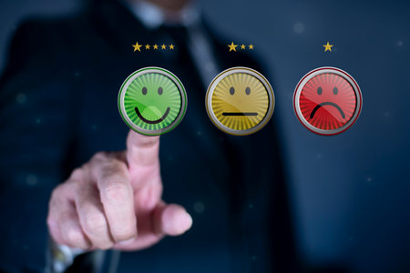 Businessman pushing smile button for the best evaluation , customer satisfaction concept.の写真素材