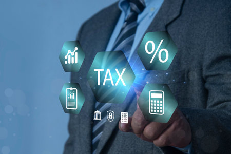 E-tax concept. Businessman show TAX for Individual income tax return form online for tax payment. Government, state taxes. Data analysis, paperwork, financial research, report.の写真素材