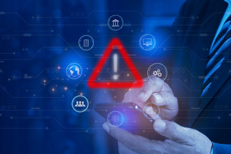 Businessman using smartphone with warning triangle. Warning of dangerous problems Server error....