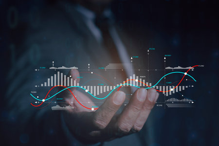 Business man holding holographic graphs and stock market statistics gain profits. analysis data plans, and reports. research on platform digital technology. analytics business conceptの写真素材