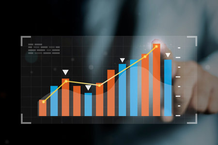 Businessman pointing graph and chart, working with digital finance technology of invest strategy for...