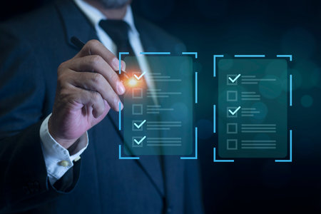 Businessman filling out and digital form checklist by laptop computer. Document Management Checking...