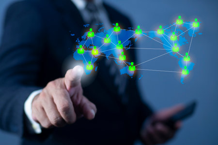 Businessman hand pointing global network connection world map people icons and line composition concept of global business.の写真素材