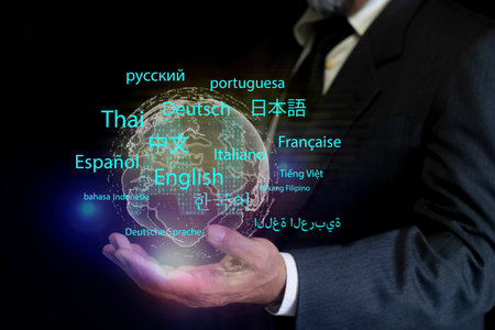 Person holds displaying an AI powered language translation app. modern global communication, language learning, AI assistant translation technology with multilingual interfaceの写真素材