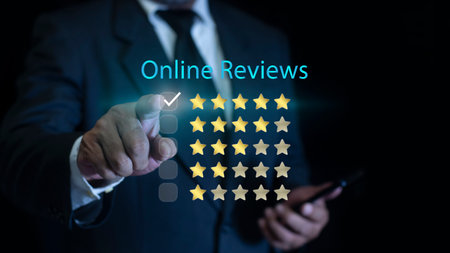 Customer review satisfaction feedback survey concept. Businessman using smartphone to give five-star positive review. Online ratings and excellent service.の写真素材