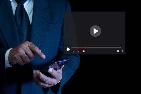 Business man watching video content online streaming on mobile smartphone. tv show, online study,...