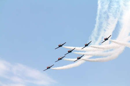 A team of seven airplanes on an air showの写真素材