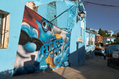 Juzcar, Malaga (Spain) - June 16, 2011: Smurfs movie poster on a wall of the villageのeditorial素材