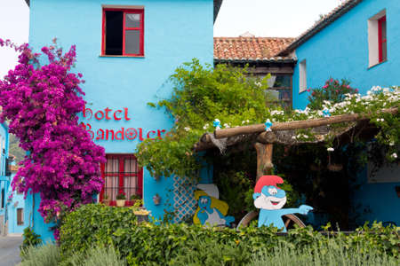 JUZCAR, SPAIN - CIRCA JUNE 2011: Hotel decorated with Smurfs pictures circa June 2011 in Malaga, Spain. The village was painted blue after Sony chose it for the world premiere of the new movie のeditorial素材