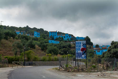 JUZCAR, SPAIN - CIRCA JUNE 2011: Smurfs sign welcomes people at the entrance of the village circa June 2011 in Malaga, Spain. The village was painted blue after Sony chose it for the world premiere of the new movie のeditorial素材