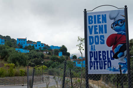 JUZCAR, SPAIN - CIRCA JUNE 2011: Smurfs sign welcomes people at the entrance of the village circa June 2011 in Malaga, Spain. The village was painted blue after Sony chose it for the world premiere of the new movie のeditorial素材