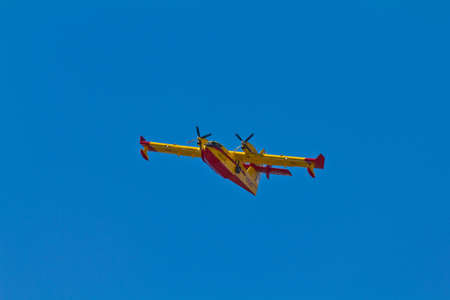 MALAGA, SPAIN - AUGUST 26: Canadair goes for water to put out fire on August 26, 2011 in Malaga, Spainのeditorial素材