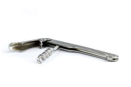 An old and rusty corkscrew isolated on white